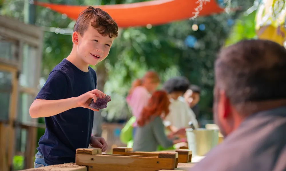 Boy sifting for gems at the Boggy Creek gem mine